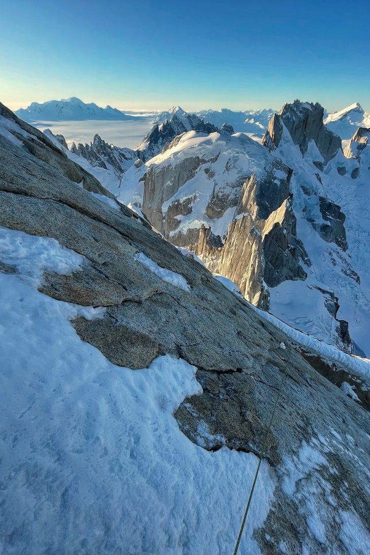 Trailing a rope while climbing the upper rock slabs of Exocet.