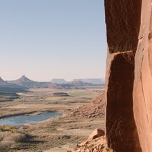a climber climbing a crack in indian creek in bears ears national monument