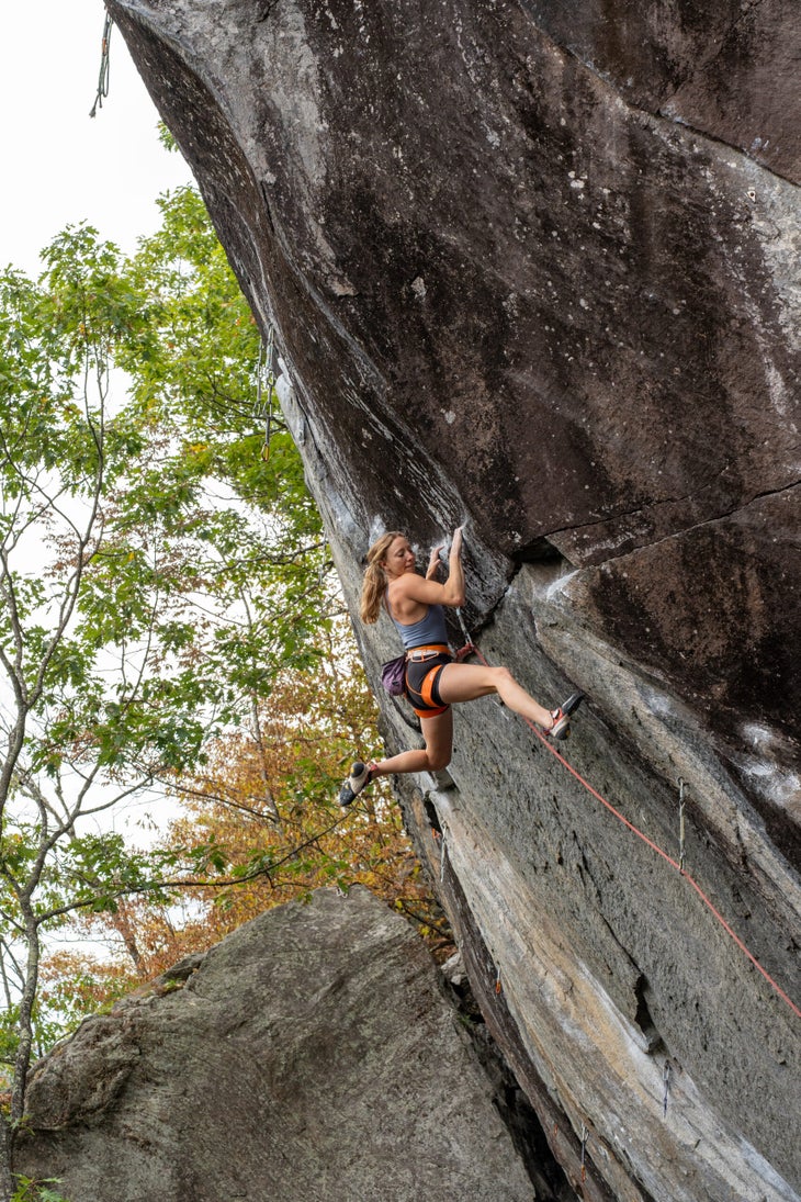 michaela kiersch climing a steep sport route in rumney