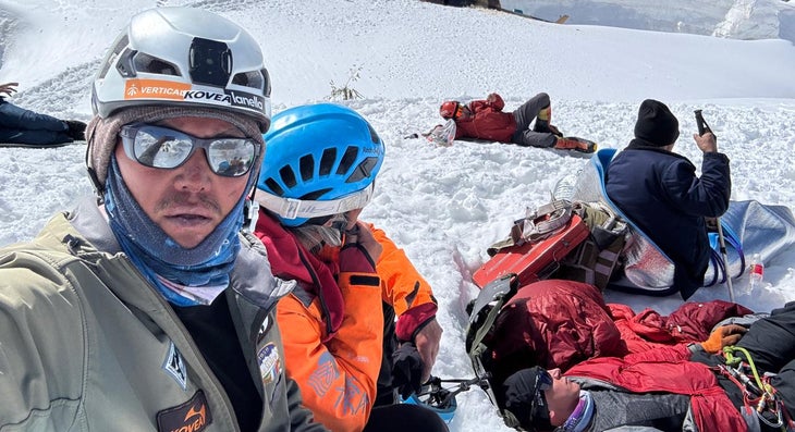 Regrouping after the helicopter crash. The tail of the machine is just visible at the top of frame.